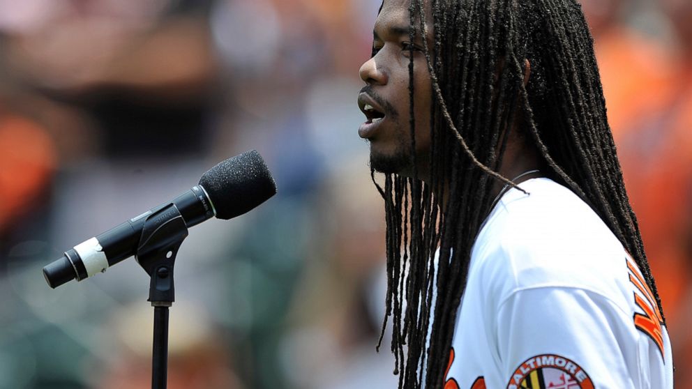 FILE - In this June 29, 2014 file photo, Jazz singer Landau Eugene Murphy, Jr. sings the National Anthem before the Baltimore Orioles and Tampa Bay Rays baseball game, in Baltimore. The America’s Got Talent” winner put his down time during the corona