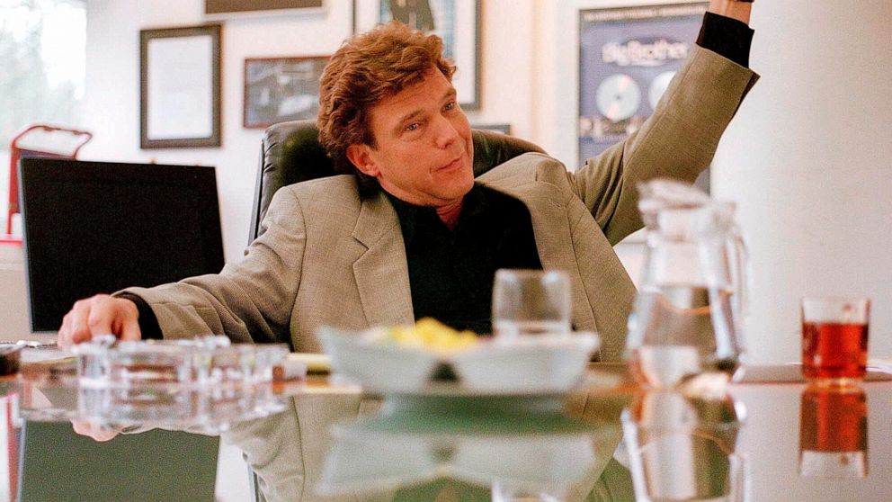 FILE- President of Dutch television production company Endemol, John de Mol, gestures while answering a question at his private office in Hilversum, Netherlands, Jan. 23, 2001. De Mol, the former producer of Dutch talent show "The Voice of Holland" a