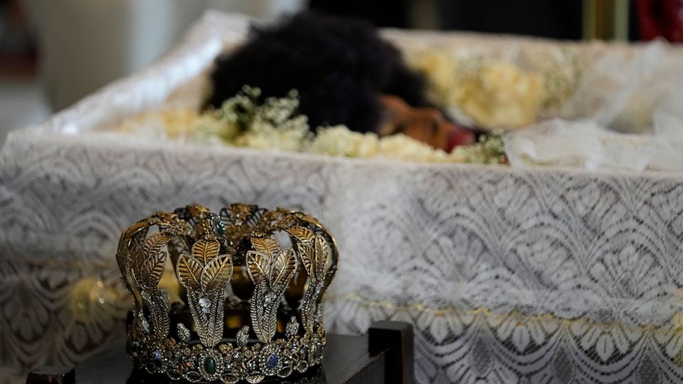 A crown sits on display next to the body of Brazilian samba singer Elza Soares as she lies in state at the Municipal Theater in Rio de Janeiro, Brazil, Friday, Jan. 21, 2022. Soares died at age 91 of natural causes in her Rio de Janeiro home on Thurs
