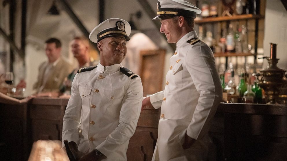 This image released by Sony Pictures shows Jonathan Majors, left, and Glen Powell in a scene from "Devotion." (Eli Ade/Columbia Pictures-Sony via AP)