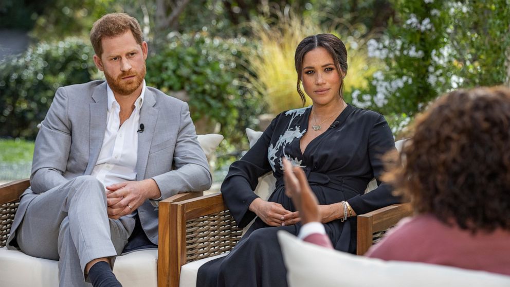 This image provided by Harpo Productions shows Prince Harry, left, and Meghan, Duchess of Sussex, in conversation with Oprah Winfrey. "Oprah with Meghan and Harry: A CBS Primetime Special" airs March 7, 2021. Britain’s royal family and television hav