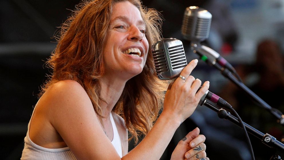 FILE - In this May 6, 2012 file photo, Ani DiFranco performs with the Preservation Hall Jazz Band at the New Orleans Jazz and Heritage Festival in New Orleans. DiFranco is the honoree and will perform at the 41st annual John Lennon tribute concert in