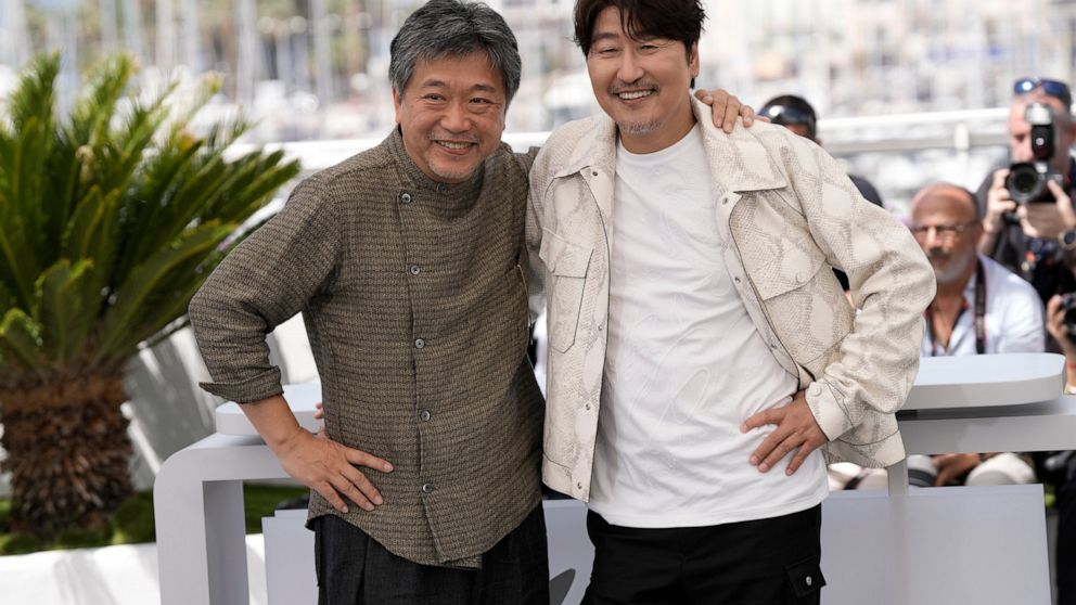 Director Hirokazu Koreeda, left, and Song Kang-ho pose for photographers at the photo call for the film 'Broker' at the 75th international film festival, Cannes, southern France, Friday, May 27, 2022. (Photo by Joel C Ryan/Invision/AP)