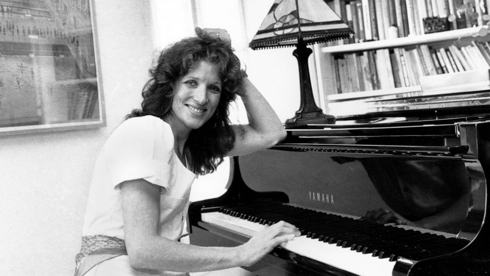 FILE - Lucy Simon sits at the piano in her New York apartment on May 28, 1982. Lucy Simon, the composer who received a Tony nomination in 1991 for her work on the long-running Broadway musical “The Secret Garden,” died Thursday at her home in Piedmon