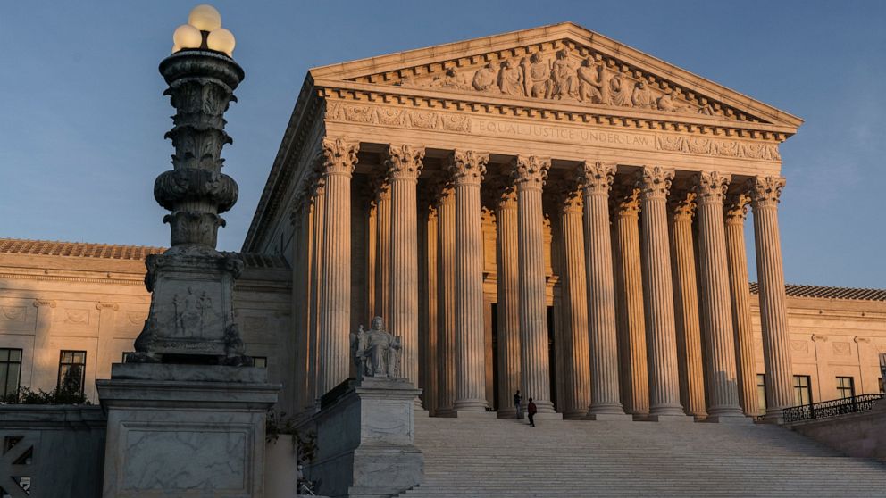 FILE - In this Nov. 6, 2020, file photo the Supreme Court is seen as sundown in Washington. (AP Photo/J. Scott Applewhite, File)