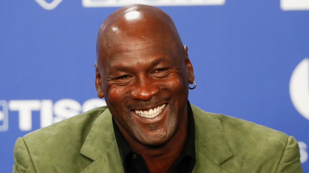 FILE - In this Jan. 24, 2020 file photo, Michael Jordan speaks during a news conference ahead of an NBA basketball game between the Charlotte Hornets and Milwaukee Bucks in Paris. Canadian blockchain technology company Dapper Labs has secured $305 mi