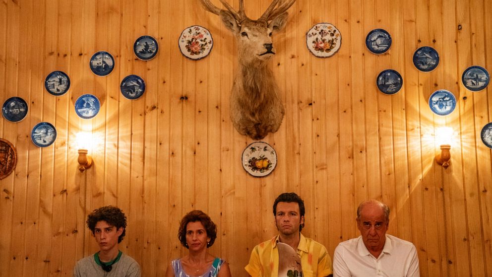 This image released by Netflix shows Filippo Scotti, from left, Teresa Saponangelo, Marlon Joubert and Toni Servillo in a scene from "The Hand of God." (Gianni Fiorito/Netflix via AP)