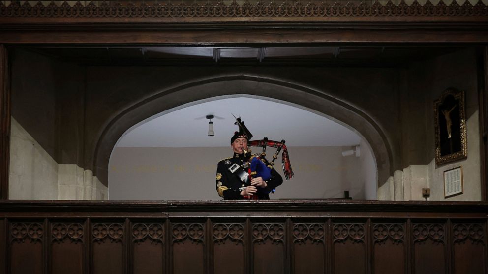 A piper plays during the funeral of Britain's Queen Elizabeth II, in London, Monday Sept. 19, 2022. (Phil Noble/Pool Photo via AP)