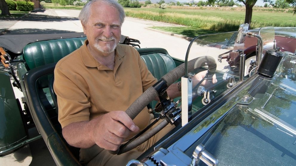 This 2007 image released by G.P. Putnam's Sons shows author Clive Cussler riding in a classic car. Cussler died on Monday, Feb. 24, 2020 at his home in Scottsdale, AZ. He was 88. (Ronnie Bramhall/G.P. Putnam's Sons via AP)