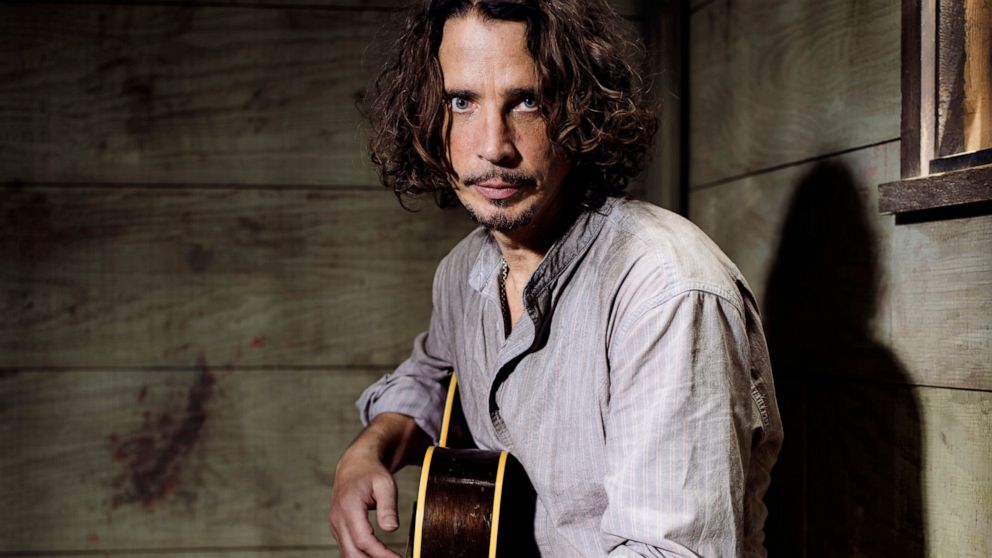 FILE - In this July 29, 2015 file photo, Chris Cornell plays guitar during a portrait session at The Paramount Ranch in Agoura Hills, Calif. The widow of the late Soundgarden frontman is suing the remaining band members and business associates. Vicky