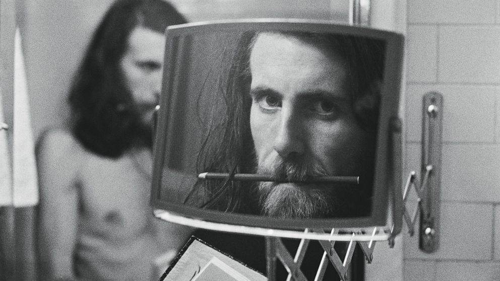 This image released by Graham Nash shows a self-portrait at The Plaza Hotel in New York in 1974. The Nash in the supergroup Crosby, Stills, Nash and Young started taking photos long before he started making music and taunts fate every day to show him