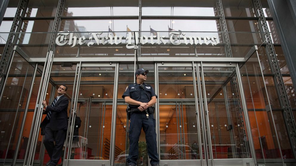 FILE - In this June 28, 2018, file photo, a police officer stands outside The New York Times building in New York. The Trump Justice Department secretly obtained the phone records of four New York Times journalists as part of a leak investigation, th