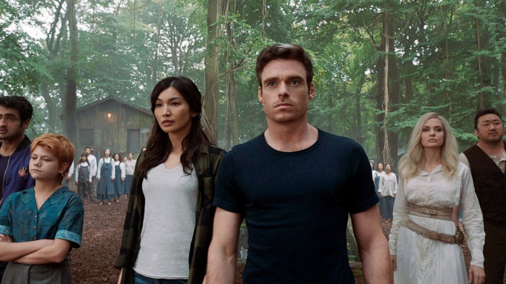 This image released by Marvel Studios shows,, from left, Kumail Nanjiani, Lia McHugh, Gemma Chan, Richard Madden, Angelina Jolie and Don Lee in a scene from "Eternals." (Marvel Studios-Disney via AP)