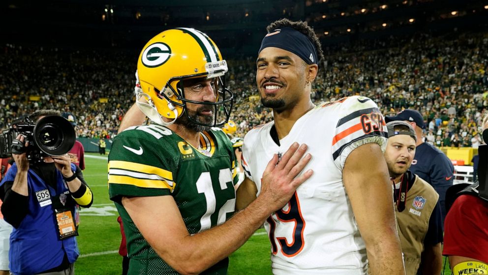 Green Bay Packers quarterback Aaron Rodgers (12) talks with Chicago Bears wide receiver Equanimeous St. Brown (19) after an NFL football game Sunday, Sept. 18, 2022, in Green Bay, Wis. The Packers won 27-10. (AP Photo/Morry Gash)