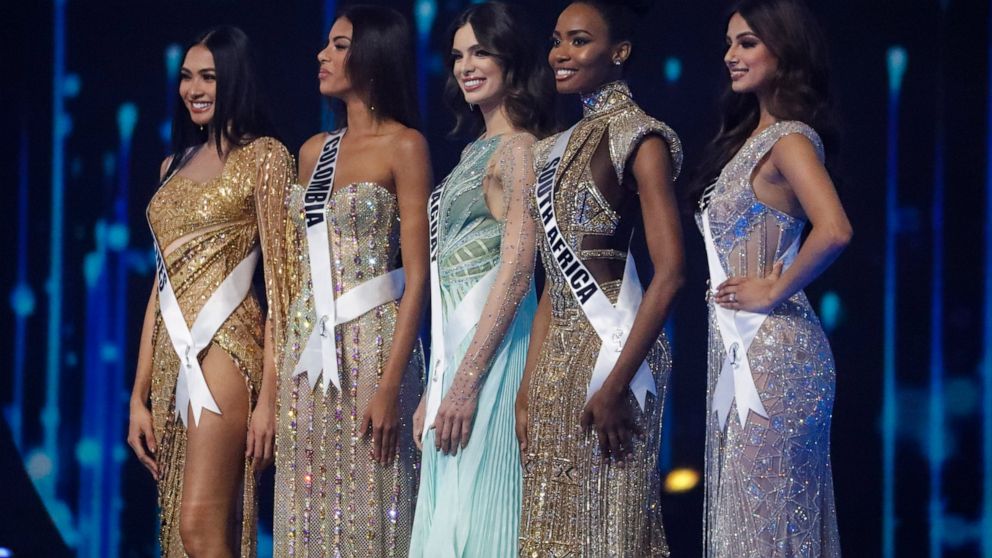 The Philippines' Beatrice Luigi Gomez, from left, Columbia's Valeria Ayos, Paraguay's Nadia Ferreira, South Africa's Lalela Mswane, and India's Harnaaz Sandhu pose as the top 5 contestants during the 70th Miss Universe pageant, Monday, Dec. 13, 2021,