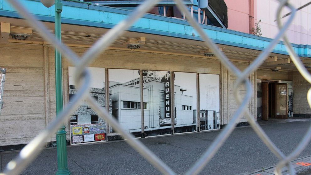 ** HOLD FOR STORY ** Fencing surrounds the 4th Avenue Theatre in Anchorage, Alaska, on Wednesday, Aug. 3, 2022. Demolition will begin in August 2022 on the once-opulent downtown Anchorage movie theater designed by the architect of Hollywood's famed P