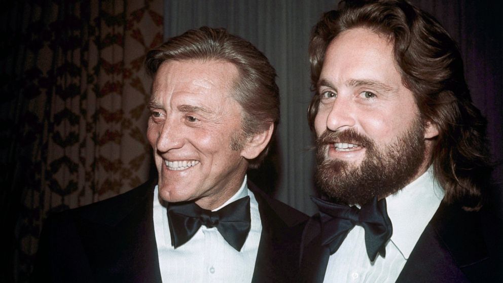 FILE - This 1976 file photo shows father-son actors Kirk Douglas, left, and Michael Douglas in New York. Kirk Douglas died Wednesday, Feb. 5, 2020 at age 103. (AP Photo, File)