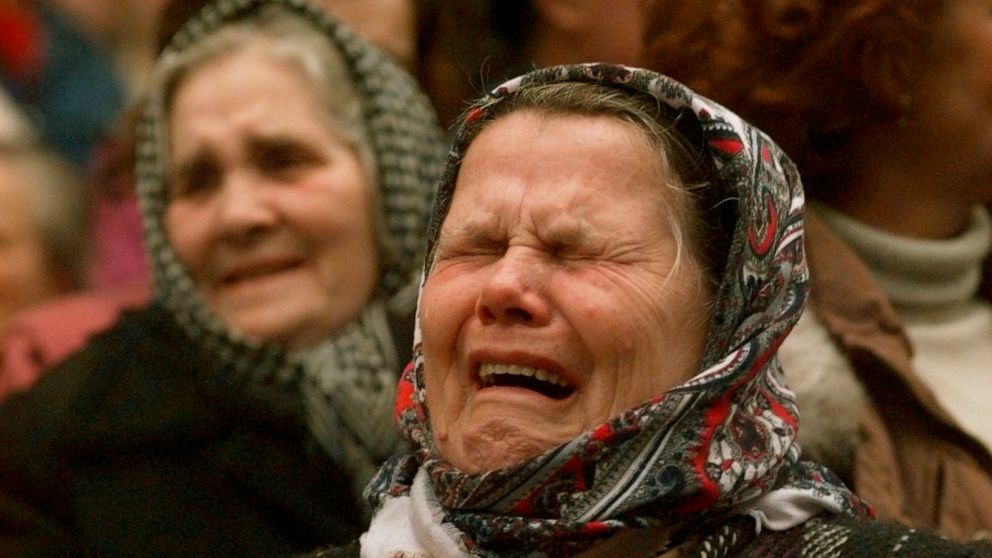 FILE - Bosnian Muslim women weep during a downtown Sarajevo rally calling for unity with their former neighbors in the Serb held neighborhood of Grbavica, on Dec. 11, 1995. Former award-winning Associated Press photographer John Gaps III, who documen