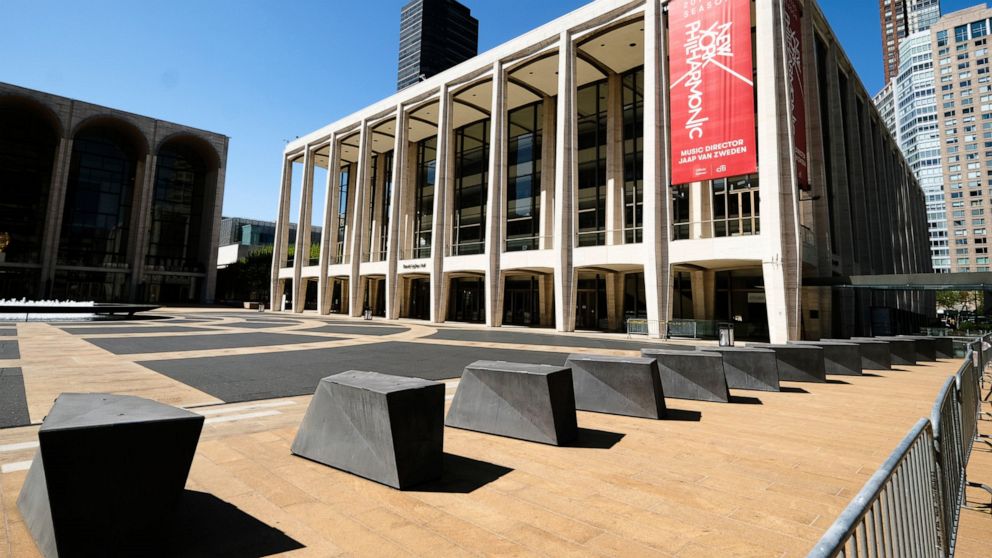 FILE - David Geffen Hall at Lincoln Center appears closed during COVID-19 lockdown in New York on May 12, 2020. The Metropolitan Opera, New York Philharmonic and Carnegie Hall are dropping their audience mask requirement starting Oct. 24, ending poli
