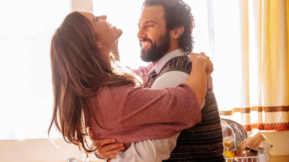 This image released by NBC shows Mandy Moore as Rebecca, left, and Milo Ventimiglia as Jack, in a scene from the final season of "This Is Us." NBC’s time-skipping family drama airs its final episode at 9 p.m. EDT Tuesday. (Ron Batzdorff/NBC via AP)