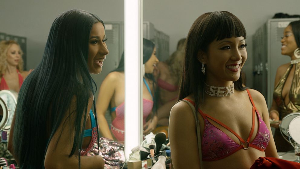 This image released by STXfilms shows Cardi B, left, and Constance Wu in a scene from "Hustlers." (STXfilms via AP)