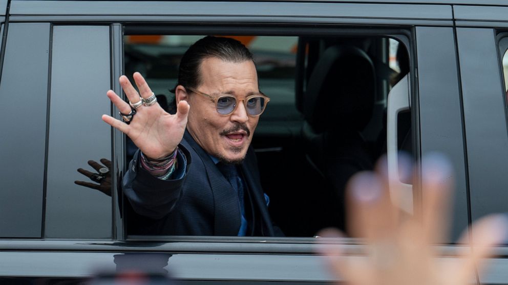 Actor Johnny Depp waves to supporters as he departs the Fairfax County Courthouse Friday, May 27, 2022 in Fairfax, Va. A jury heard closing arguments in Johnny Depp's high-profile libel lawsuit against ex-wife Amber Heard. Lawyers for Johnny Depp and