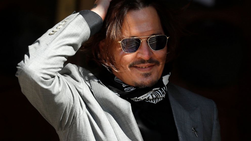 FILE - In this file photo dated Tuesday, July 28, 2020, US Actor Johnny Depp arrives at the High Court in London during his case against News Group Newspapers over a story published about his former wife Amber Heard, which branded him a 'wife beater'