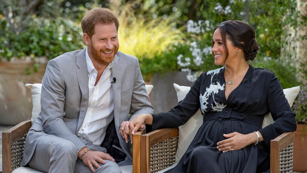 This image provided by Harpo Productions shows Prince Harry, left, and Meghan, Duchess of Sussex, speaking about expecting their second child during an interview with Oprah Winfrey. "Oprah with Meghan and Harry: A CBS Primetime Special" airs March 7 