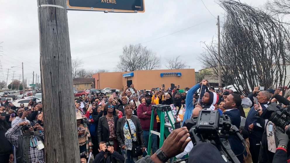 A street sign is unveiled to honor slain rapper Young Dolph, whose real name is Adolph Thornton Jr., on Wednesday, Dec. 15, 2021, in Memphis, Tenn. Police said Young Dolph was killed Nov. 17 while buying cookies at his favorite bakery. No arrests hav