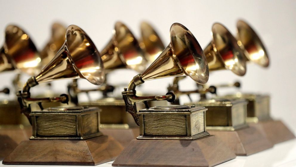 FILE - In this Oct. 10, 2017, file photo, various Grammy Awards are displayed at the Grammy Museum Experience at Prudential Center in Newark, N.J. The Grammy Awards are in discussion to remove its nomination review committees — the group that determi