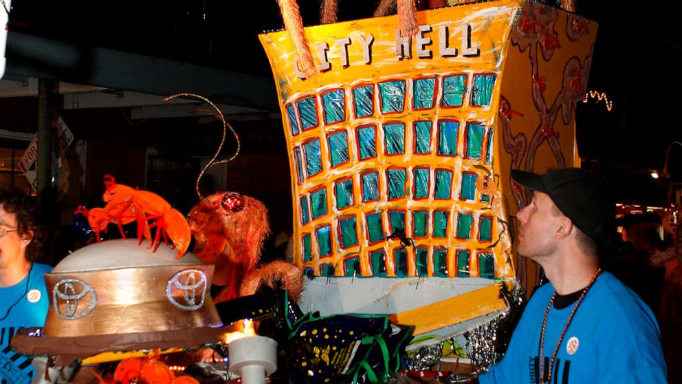 FILE - A Krewe du Vieux float passes through the streets of the French Quarter celebrating the Mardi Gras season in New Orleans, Saturday, Feb. 4, 2012. New Orleans’ health director says she won’t take part in one of the earliest of the Mardi Gras se