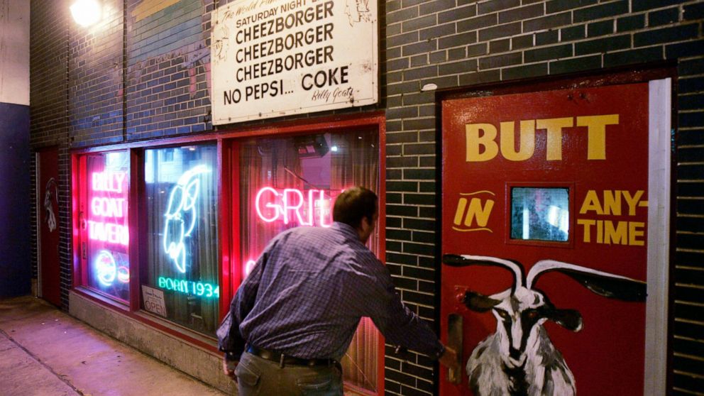 FILE - In this Sept. 23, 2005 file photo, a customer enters the Billy Goat Tavern under Chicago's Michigan Ave. The once-busy diner tucked below a Michigan Avenue overpass in Chicago famously inspired a Saturday Night Live skit starring John Belushi 