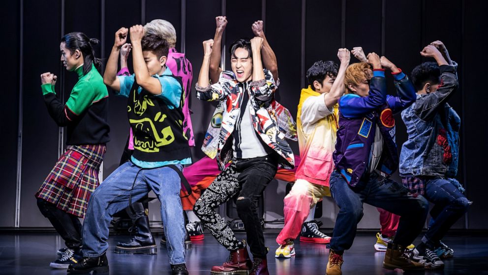 This image released by O+M/DKC shows Kevin Woo, center, and the cast during a performance of “KPOP,” opening Nov. 27 at the Circle in the Square Theatre in New York. (Matthew Murphy/O+M/DKC via AP)