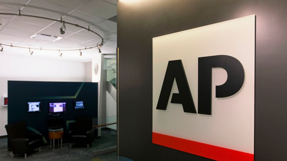 FILE - This Tuesday, April 26, 2016 file photo shows The Associated Press logo in New York. The Associated Press has pulled out of its planned coverage of Wednesday's CMA Awards show due to a dispute over photographs of the broadcast. (AP Photo/Hiro 
