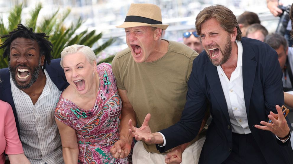Jean-Christophe Folly, from left, Vicki Berlin, Woody Harrelson, and Ruben Östlund pose for photographers at the photo call for the film 'Triangle of Sadness' at the 75th international film festival, Cannes, southern France, Sunday, May 22, 2022. (Ph