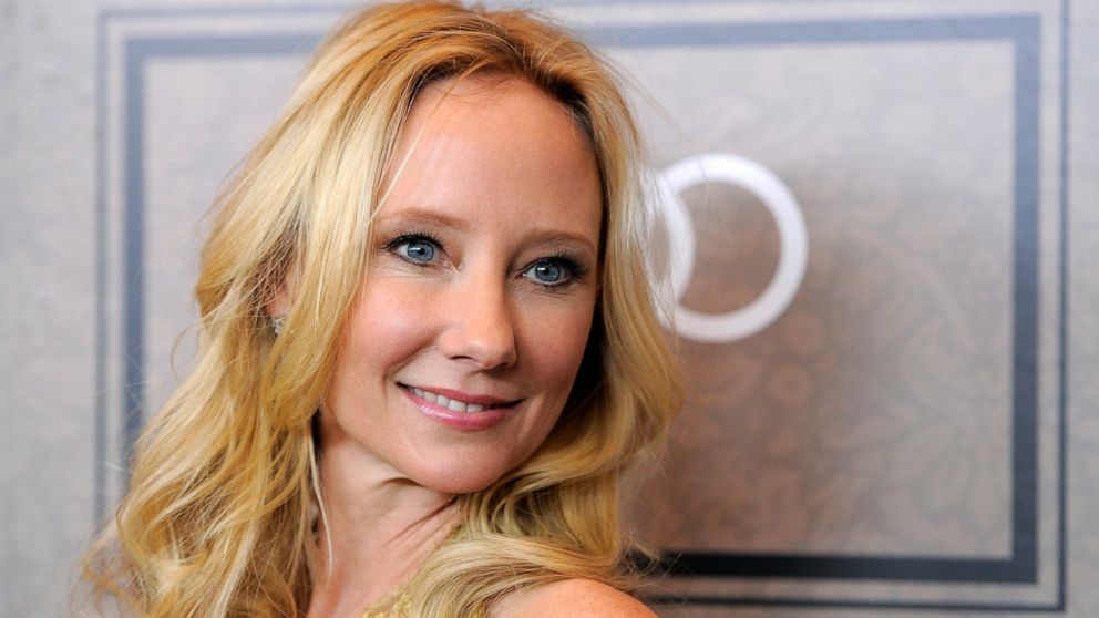 FILE - Actor Anne Heche poses at Variety's 4th annual Power of Women event in Beverly Hills, Calif., on Oct. 5, 2012. A spokesperson for Heche says the actor is on life support after suffering a brain injury in a fiery crash a week ago and isn't expe