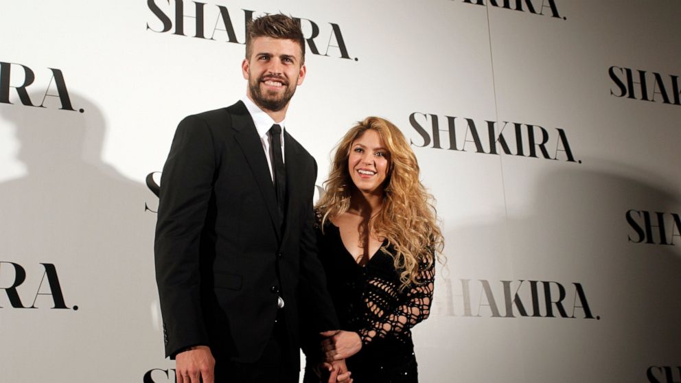 FILE - Colombian singer Shakira, right, and FC Barcelona's soccer player Gerard Pique pose to the media during the presentation of her new album "Shakira" in Barcelona, Spain, on March 20, 2014. Colombian pop star Shakira and her partner, Spanish soc