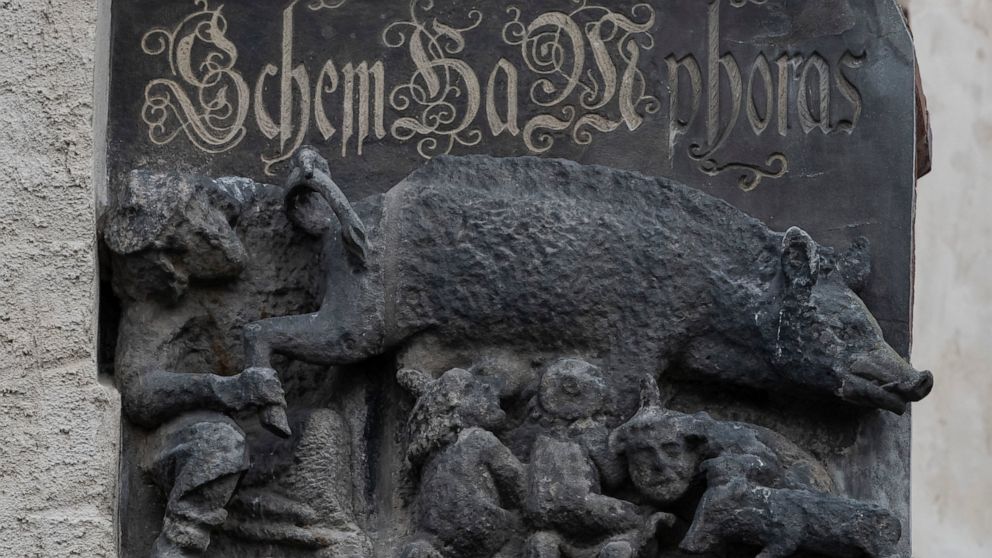 FILE - The so-called "Judensau," or "Jew pig," sculpture is displayed on the facade of the Stadtkirche (Town Church) in Wittenberg, Germany, Jan. 14, 2020. A German federal court on Monday mulled a Jewish man's bid to force the removal of the 700-yea