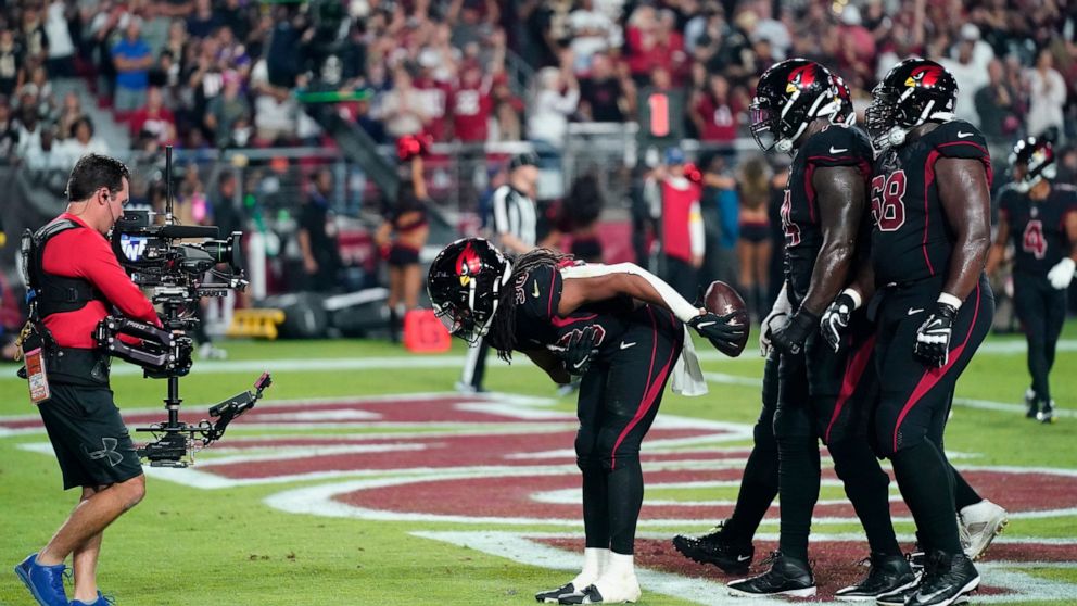 Arizona Cardinals running back Keaontay Ingram (30) celebrate his touchdown during the first half of an NFL football game against the New Orleans Saints, Thursday, Oct. 20, 2022, in Glendale, Ariz. (AP Photo/Ross D. Franklin)