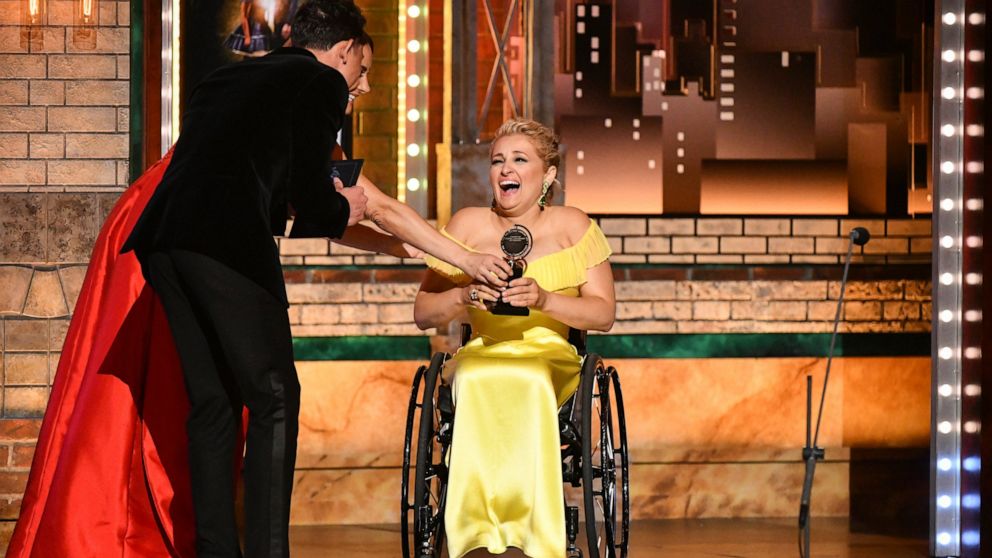 Laura Benanti, from left, and Anthony Ramos present best performance by an actress in a featured role in a musical to Ali Stroker for "Rodgers & Hammerstein's Oklahoma!" at the 73rd annual Tony Awards on Sunday, June 9, 2019, in New York.
