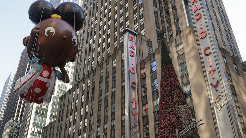 The Ada Twist, Scientist balloon floats past Radio City Music Hall during the Macy's Thanksgiving Day Parade, Thursday, Nov. 24, 2022, in New York. (AP Photo/Jeenah Moon)