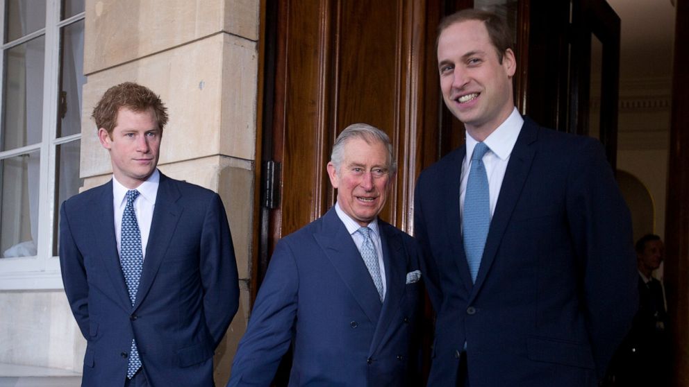 FILE - In this Feb. 13, 2014 file photo, Britain's Prince Charles, center, with his sons Prince William, right, and Prince Harry stops for the media outside Lancaster House as they arrive to attend the Illegal Wildlife Trade Conference in London. Pri