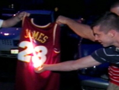 VIDEO: Unhappy Cavaliers fans take to torching LeBron James paraphernalia.