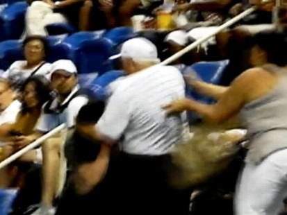 VIDEO: A trio of arguing tennis fans start a fight in the stands.