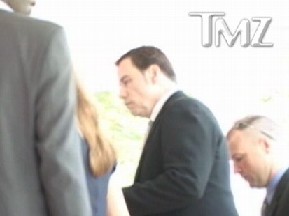 Video: Actor John Travolta arrives at court to testify in extortion case.