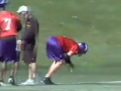 VIDEO: Brett Favre gets socked in the groin by a football during practice.