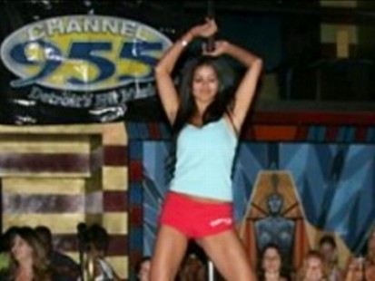 VIDEO: 007 photos show Rima Fakih participating in a Stripper 101 radio contest.