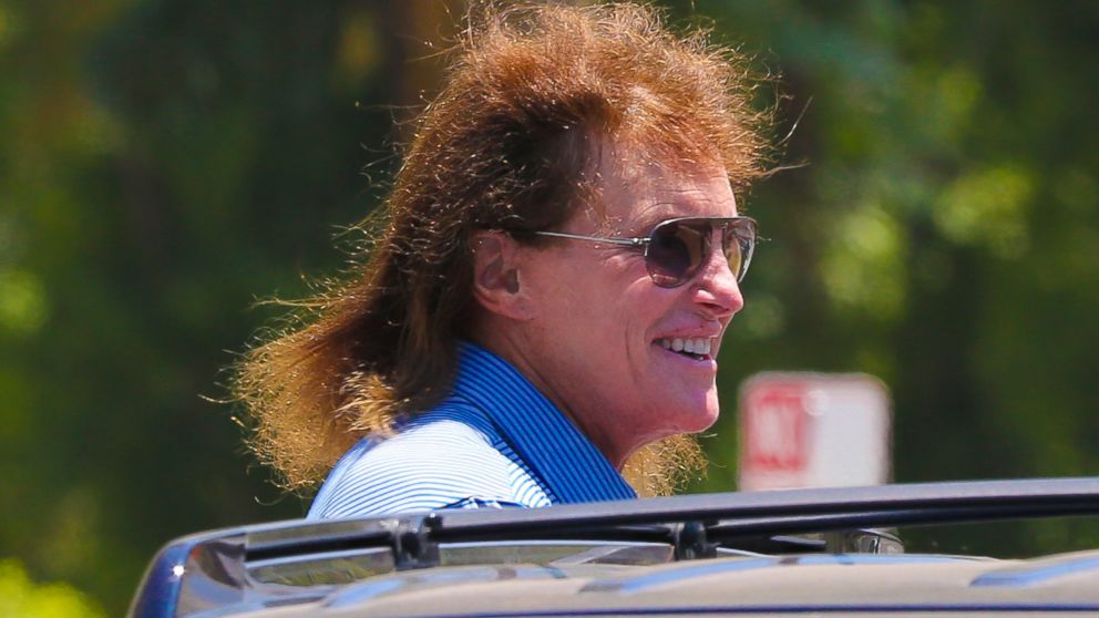 Bruce Jenner looked right out of the 80's rock era as he returns to his car after grabbing a coffee at Starbucks in Calabasas, Calif. 