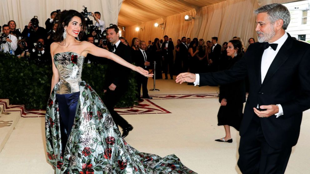 PHOTO: Amal Clooney and George Clooney arrive at The Metropolitan Museum of Art's Costume Institute Benefit celebrating the opening of Heavenly Bodies: Fashion and the Catholic Imagination, New York, May 7, 2018.