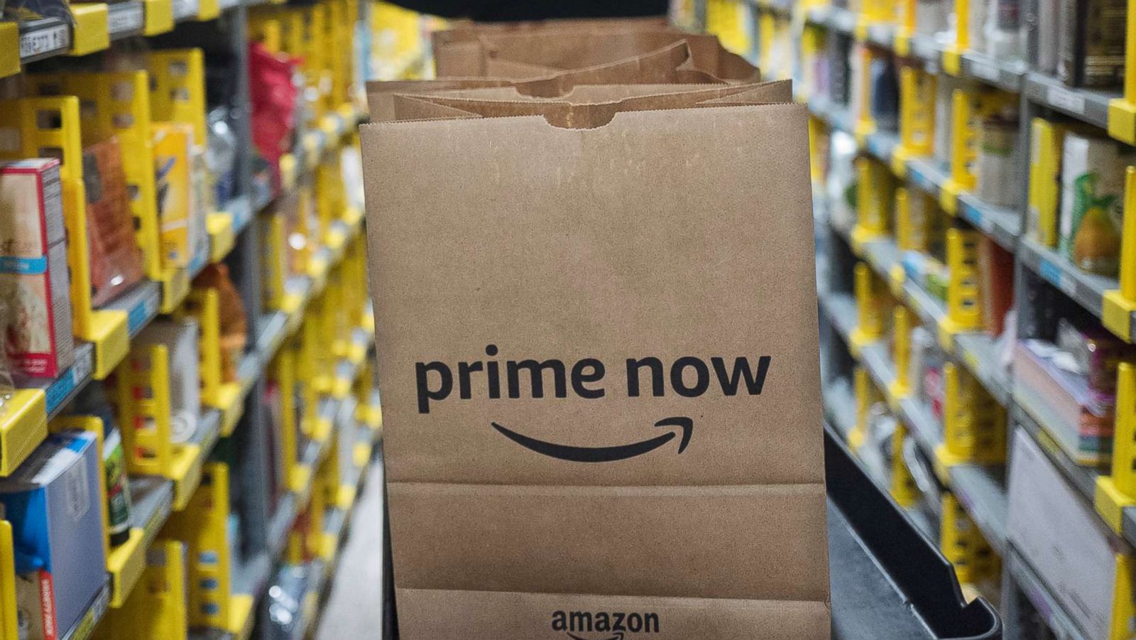 PHOTO: A clerk reaches to a shelf to pick an item for a customer order at the Amazon Prime warehouse in New York, Dec. 20, 2017.